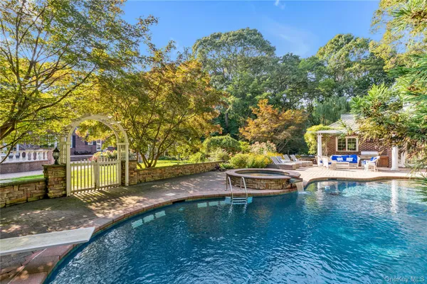 a view of a swimming pool with a patio