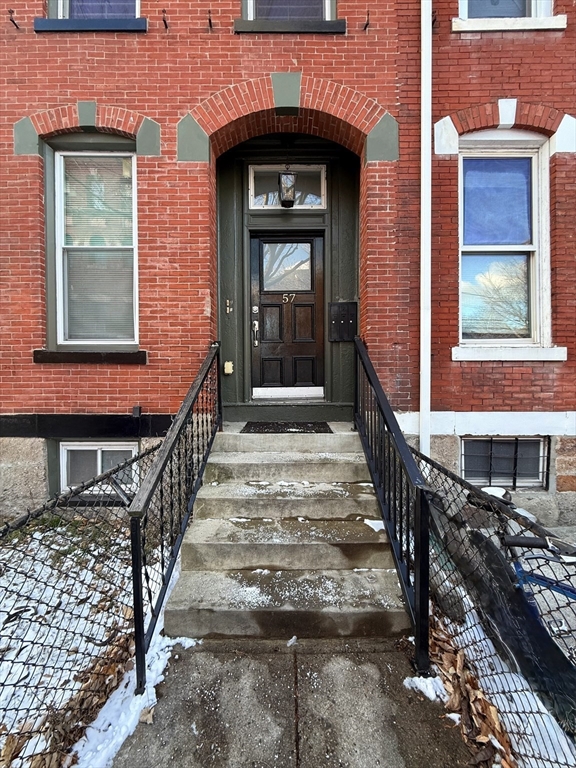57 Coleman Street, Unit 2 Boston, MA 02125 - Photo 1 of 24 a view of a brick house with wooden floor and windows