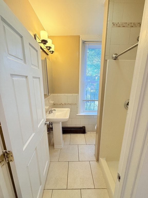 57 Coleman Street, Unit 2 Boston, MA 02125 - Photo 14 of 24 a bathroom with a sink a toilet and shower