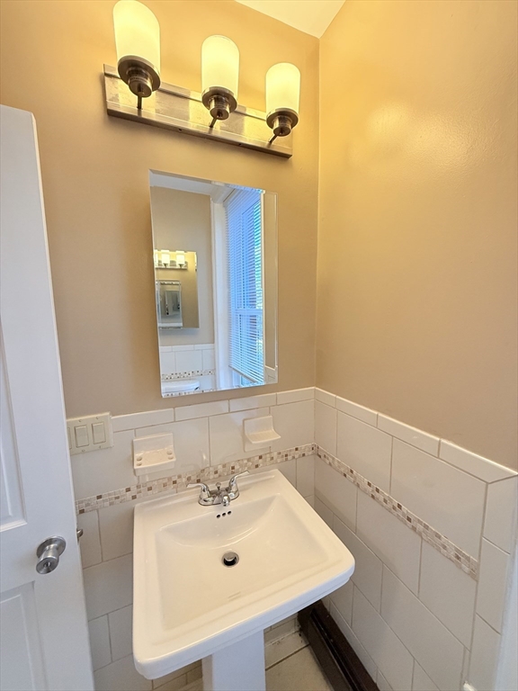 57 Coleman Street, Unit 2 Boston, MA 02125 - Photo 15 of 24 a bathroom with a sink and a mirror