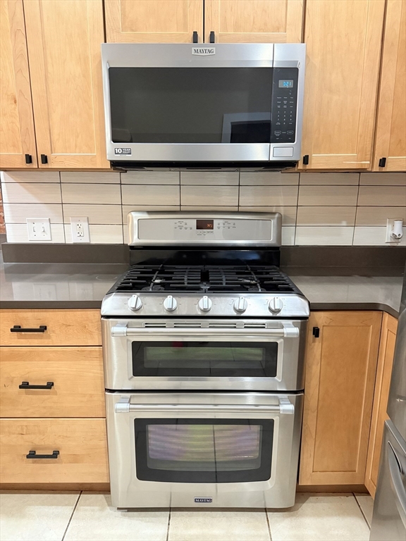 57 Coleman Street, Unit 2 Boston, MA 02125 - Photo 6 of 24 a stove top oven sitting inside of a kitchen