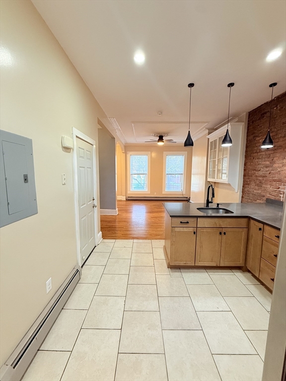 57 Coleman Street, Unit 2 Boston, MA 02125 - Photo 8 of 24 a large kitchen with a sink and cabinets