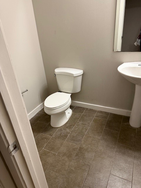 5925 Almeda Road, Unit 11408 Houston, TX 77004 - Photo 11 of 19 a white toilet sitting next to a white sink and vanity