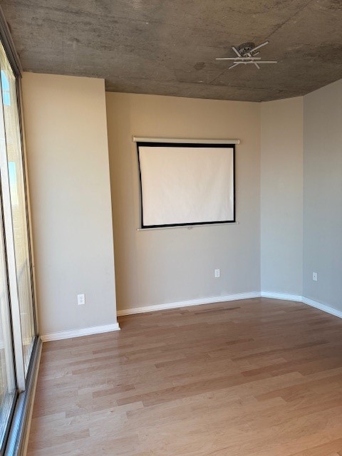 5925 Almeda Road, Unit 11408 Houston, TX 77004 - Photo 16 of 19 a view of an empty room with wooden floor and a window