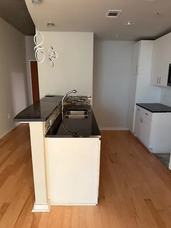 a kitchen with a stove and a refrigerator