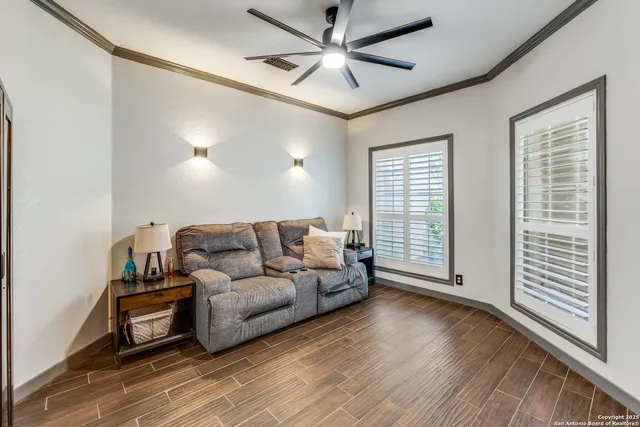 a view of a livingroom with furniture window and wooden floor