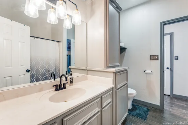 a bedroom with a bed and a mirror