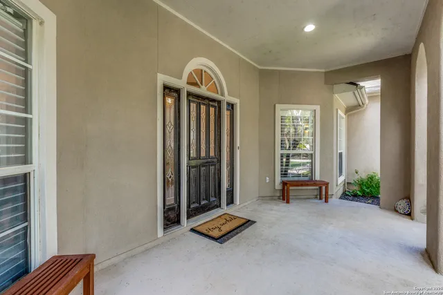 a view of entryway with livingroom and chandelier