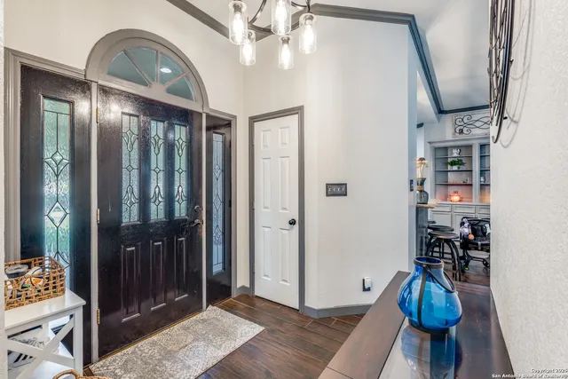 a living room with furniture a rug and a flat screen tv