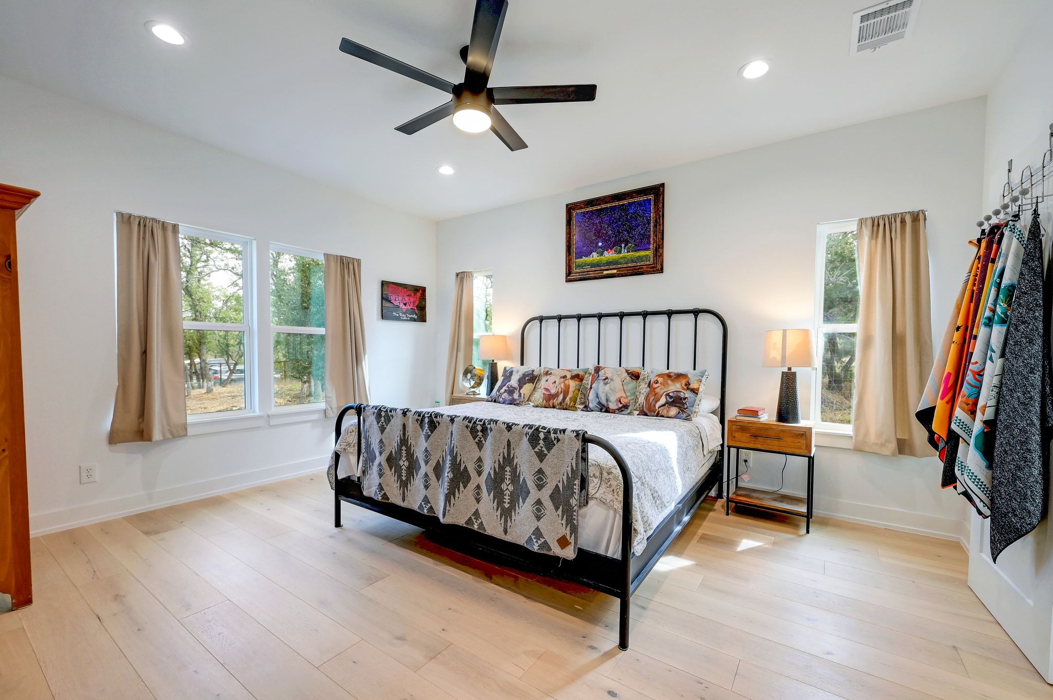 200 Rust Ranch Road Blanco, TX 78606 - Photo 10 of 26 a spacious bedroom with a bed and a large window