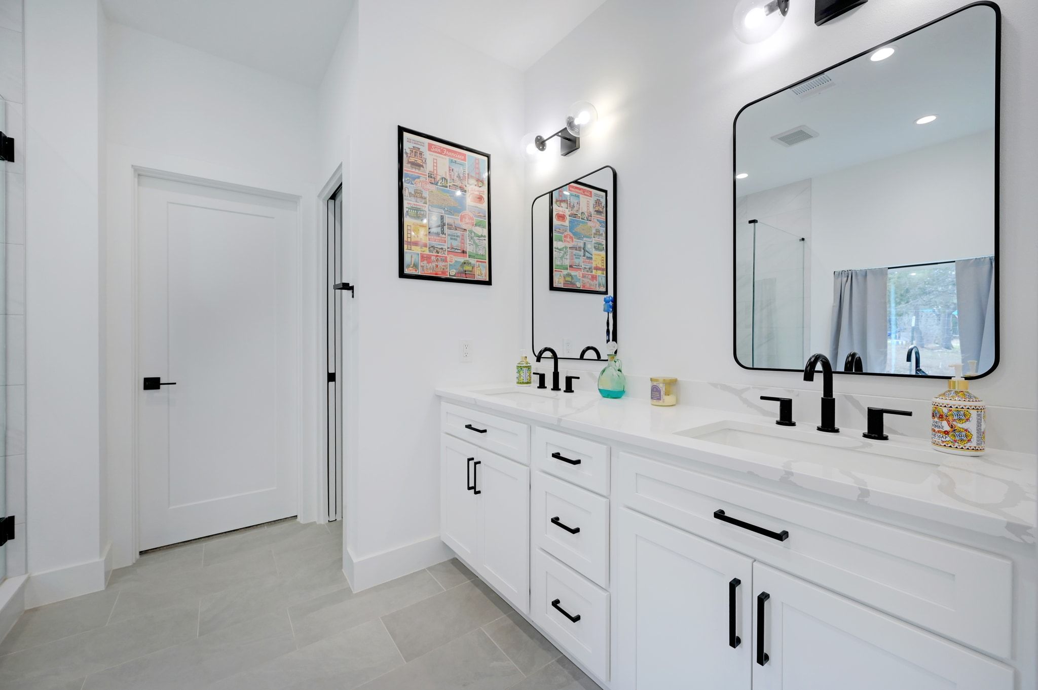 200 Rust Ranch Road Blanco, TX 78606 - Photo 11 of 26 a bathroom with double vanity sink and a mirror