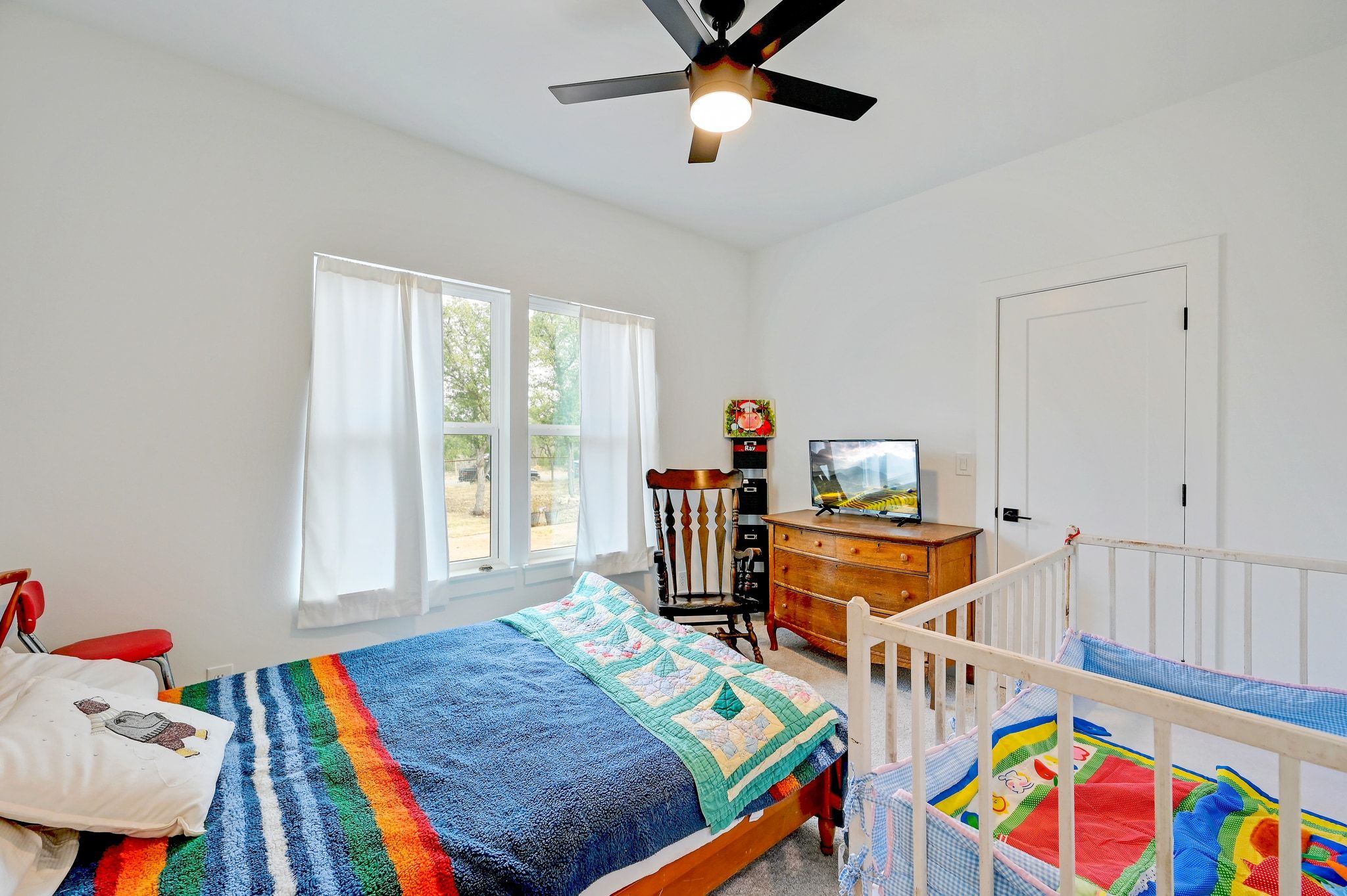 200 Rust Ranch Road Blanco, TX 78606 - Photo 16 of 26 a bed room with furniture and a window