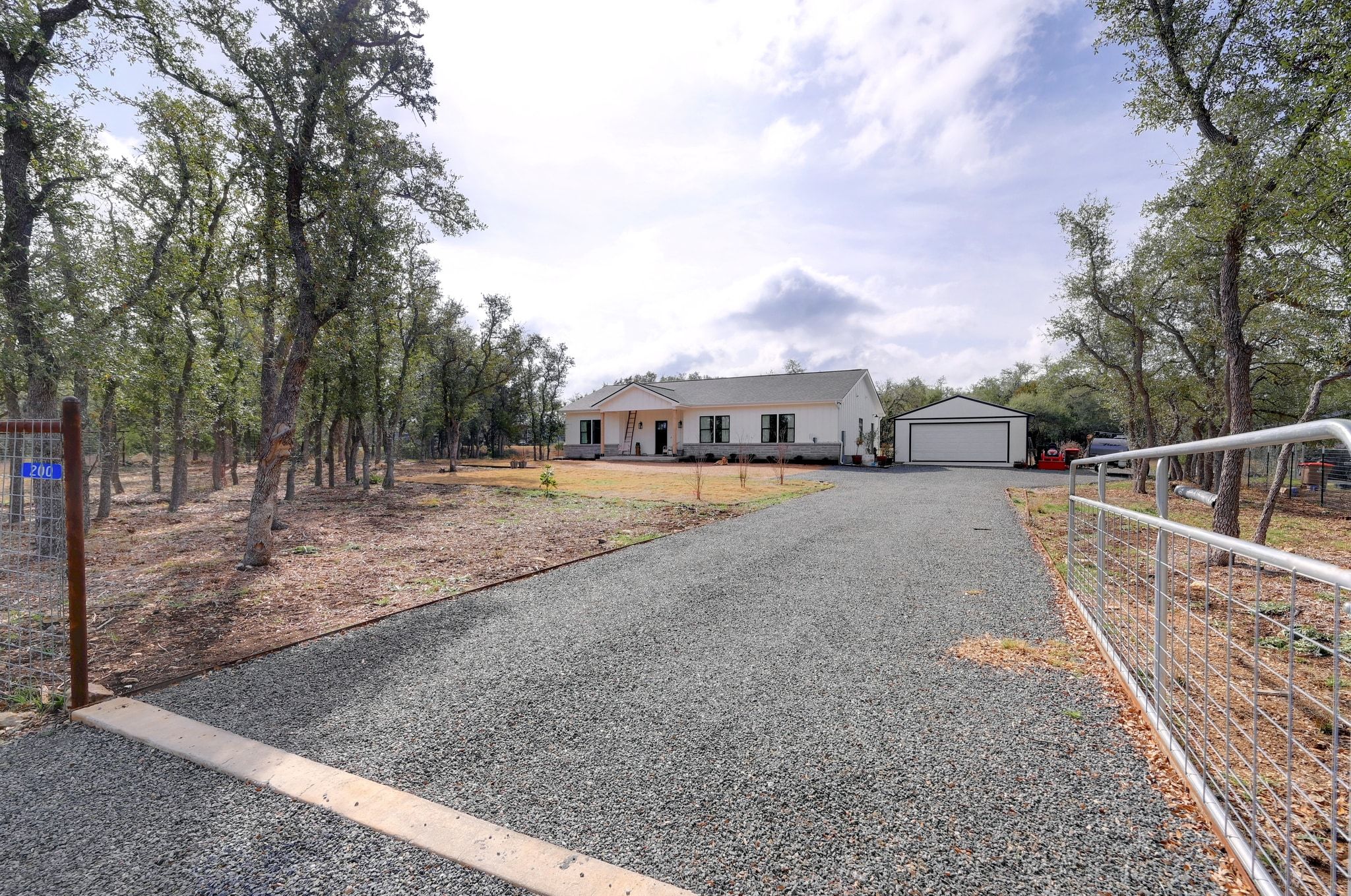 200 Rust Ranch Road Blanco, TX 78606 - Photo 2 of 26 a view of city street with a house