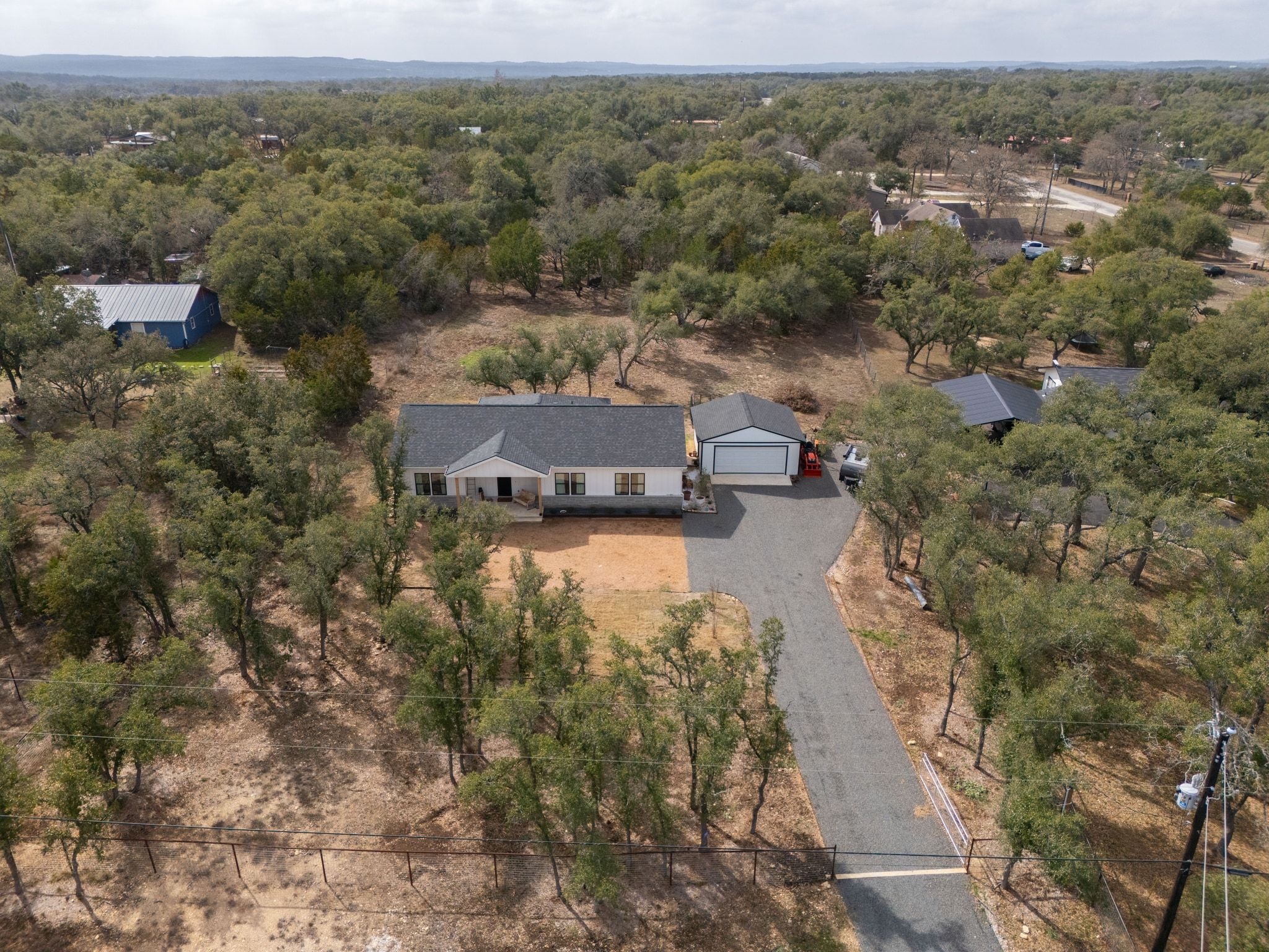 200 Rust Ranch Road Blanco, TX 78606 - Photo 24 of 26 an aerial view of a house with a yard