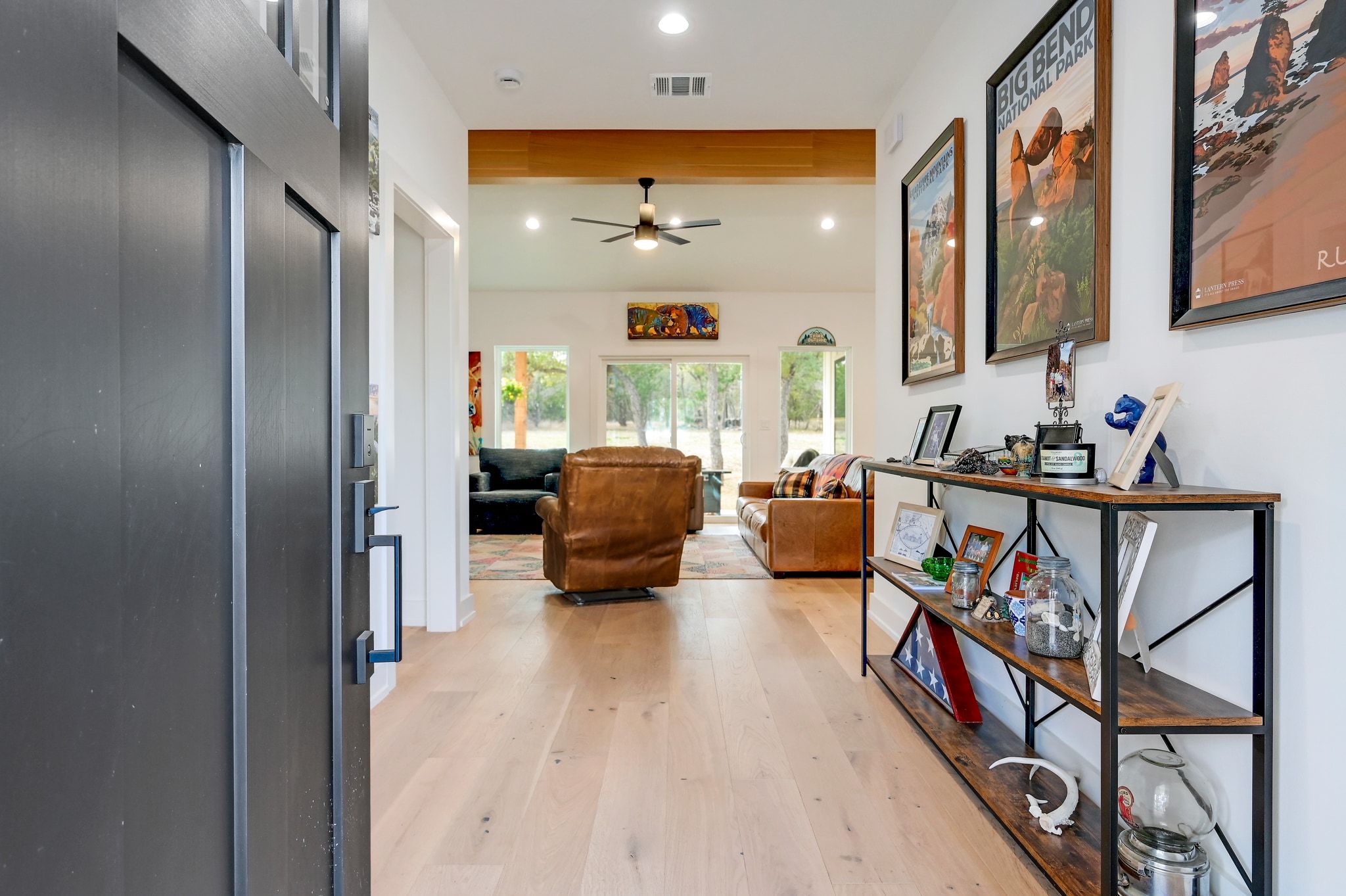 200 Rust Ranch Road Blanco, TX 78606 - Photo 4 of 26 a living room with furniture and a flat screen tv