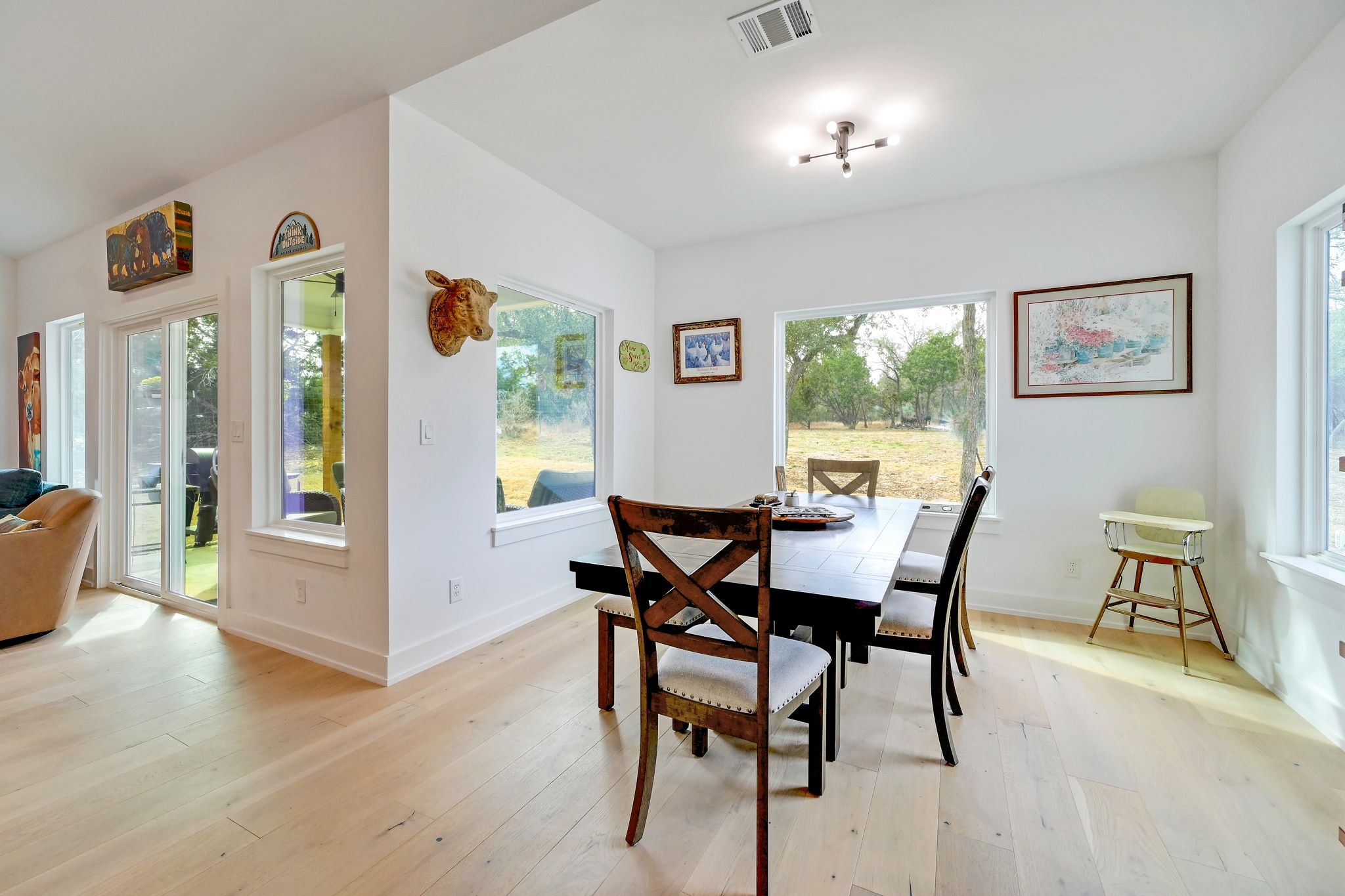 200 Rust Ranch Road Blanco, TX 78606 - Photo 8 of 26 a view of a dining room with furniture window and wooden floor