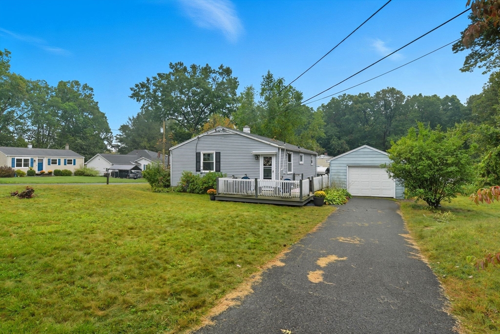 196 Sawmill Road Springfield, MA 01118 - Photo 31 of 38 a front view of house with yard and green space