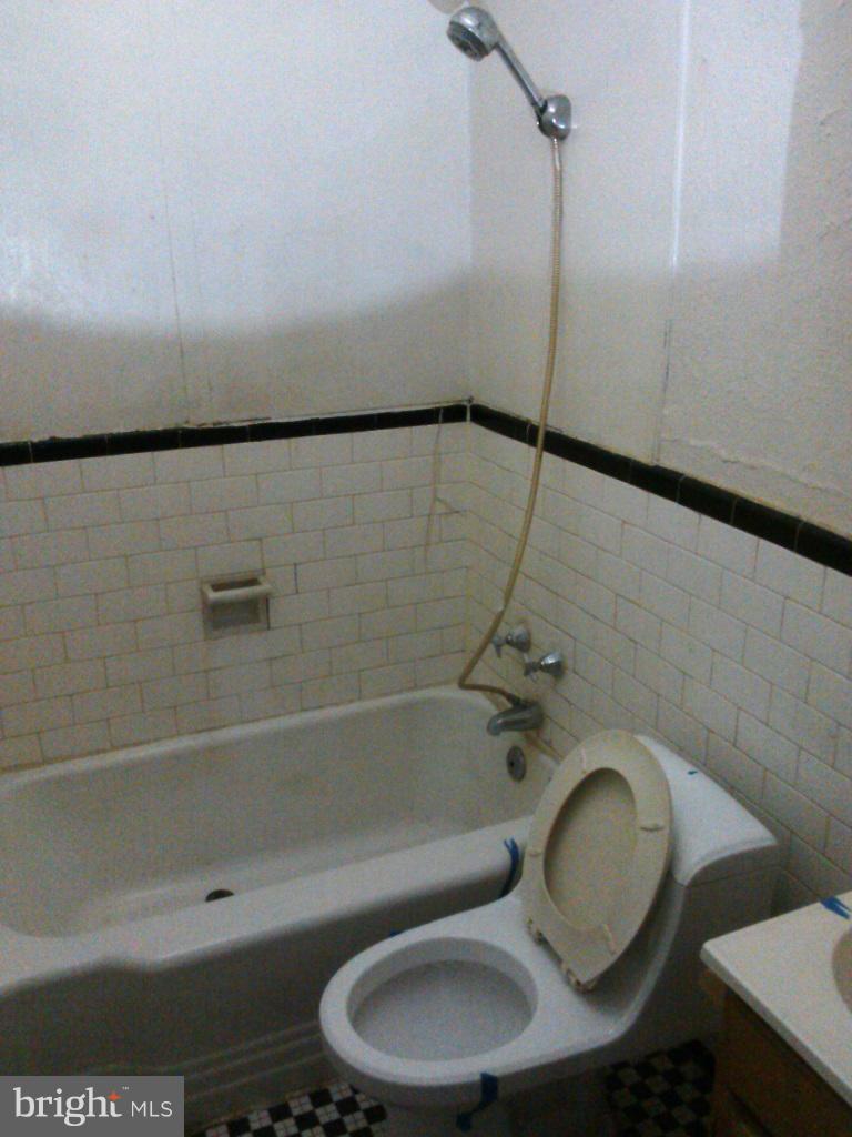 2936 Cornwall Road Dundalk, MD 21222 - Photo 5 of 13 a bathroom with a toilet and a shower