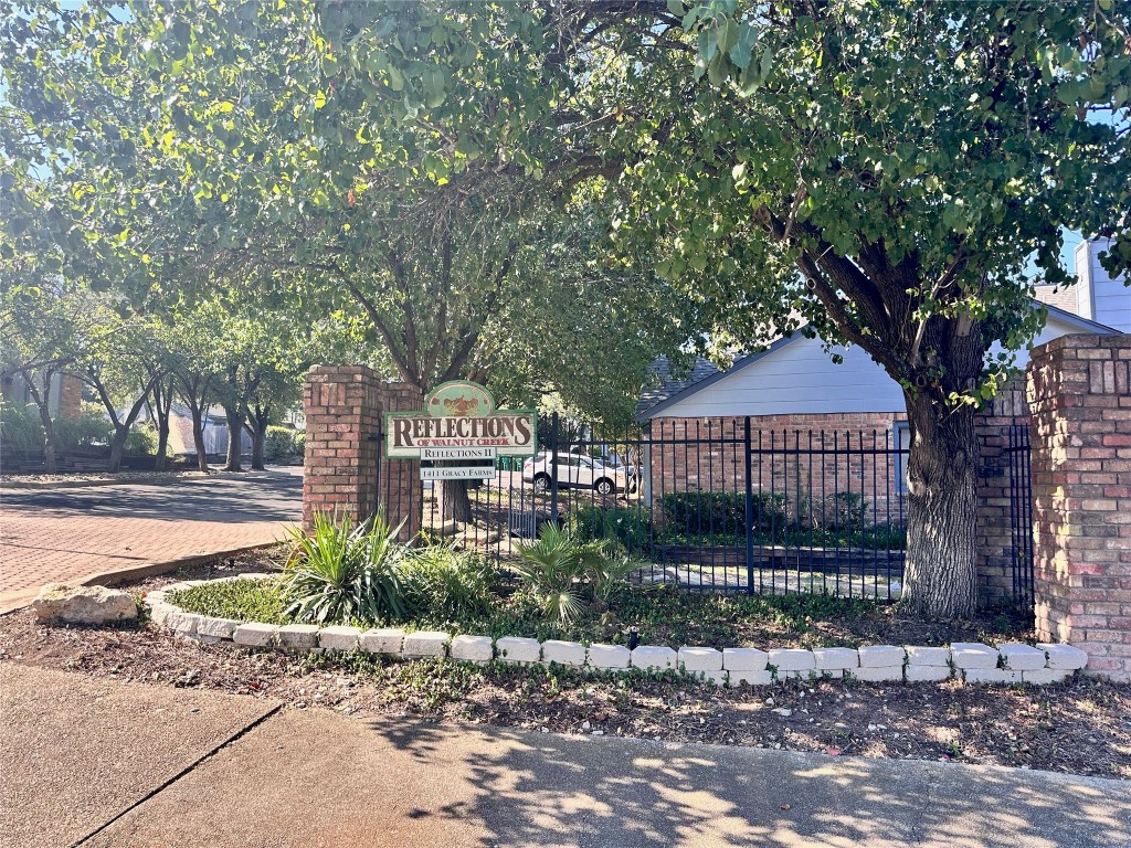 1411 Gracy Farms Lane, Unit 102 Austin, TX 78758 - Photo 11 of 12 a front view of a house with garden