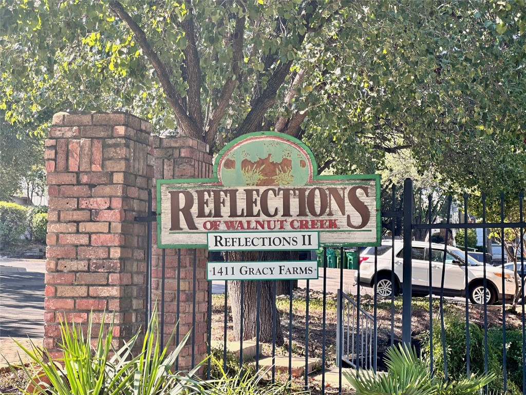 1411 Gracy Farms Lane, Unit 102 Austin, TX 78758 - Photo 12 of 12 a sign on the side of a building
