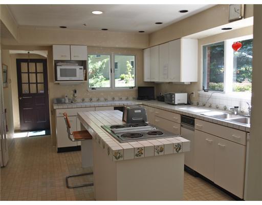 308 Sycamore Road Edgeworth, PA 15143 - Photo 8 of 18 Kitchen. Another view of the kitchen, showing the ample storage space; electric cooktop, double bowl sink, microwave, electric stove, sub-zero refrigerator; disposal, trash masher