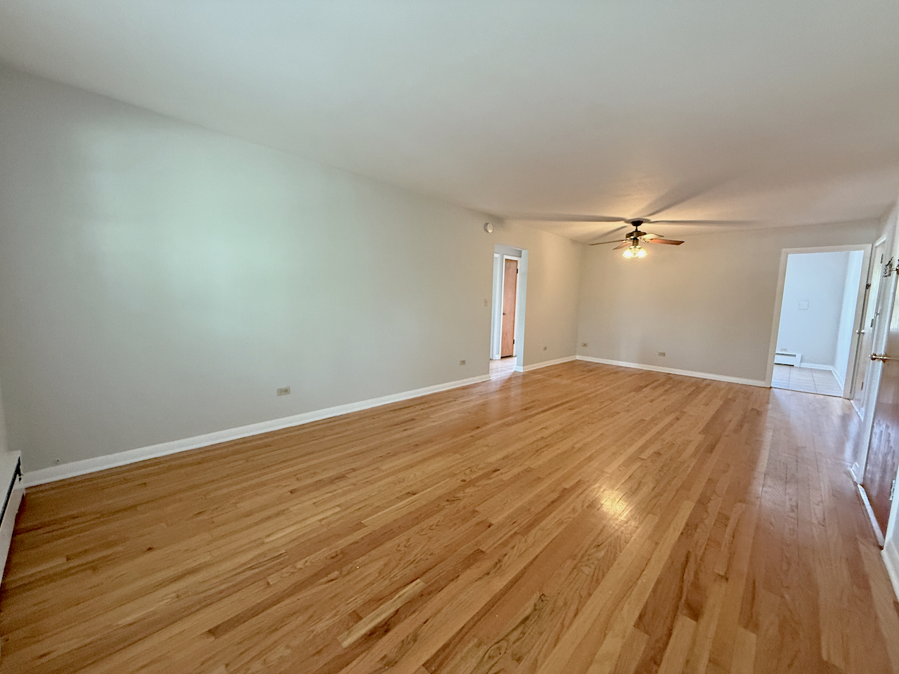 317 South Plum Grove Road, Unit 5 Palatine, IL 60067 - Photo 4 of 14 a view of empty room with wooden floor