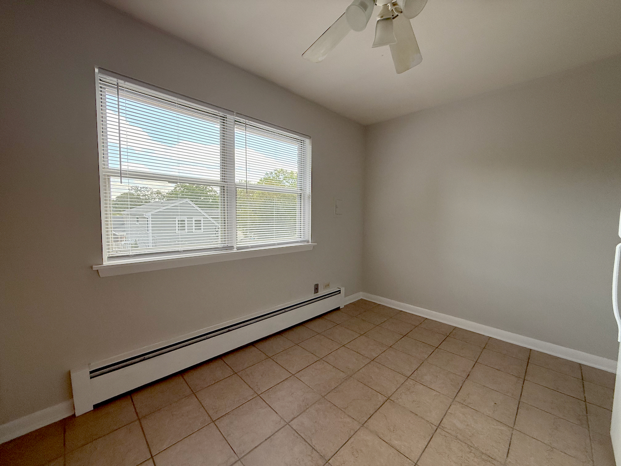 317 South Plum Grove Road, Unit 5 Palatine, IL 60067 - Photo 8 of 14 an empty room with windows
