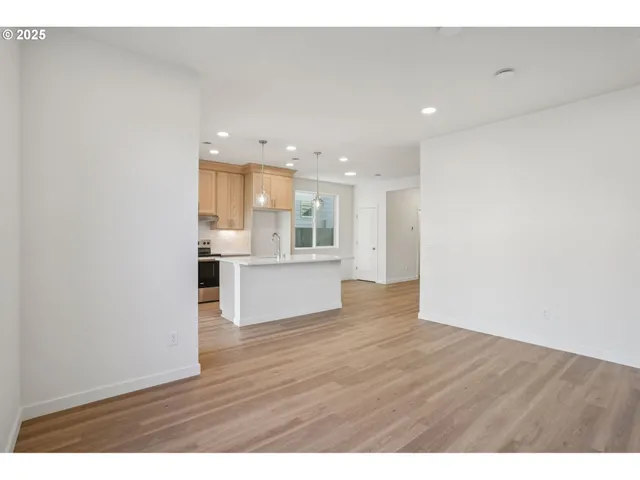 a view of a kitchen with wooden floor