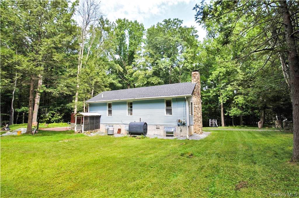 16 Woodland Road Middletown, NY 10940 - Photo 13 of 13 a view of a house with a yard porch and sitting area