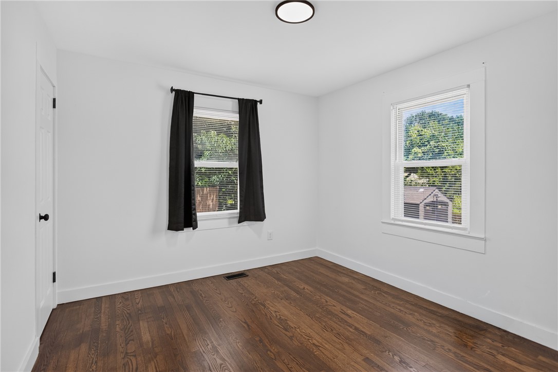 115 Pelfrey Street Seneca, SC 29672 - Photo 17 of 46 Hardwood floors and bright windows define this comfortable and inviting bedroom space.