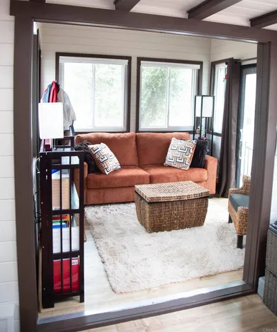 a living room with furniture and window