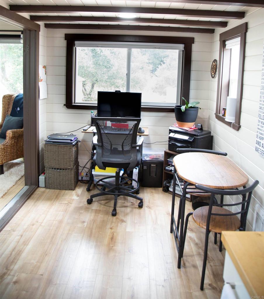 14625 Mussey Grade Road, Unit R67 Ramona, CA 92065 - Photo 13 of 31 a view of a workspace with furniture and a window