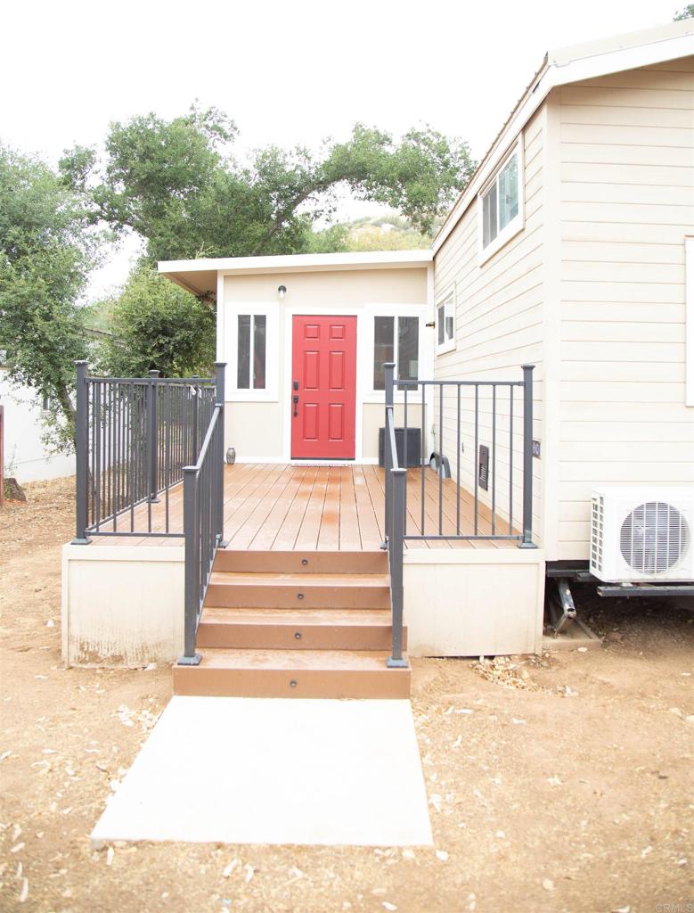 14625 Mussey Grade Road, Unit R67 Ramona, CA 92065 - Photo 18 of 31 a view of a house with a yard and sitting area