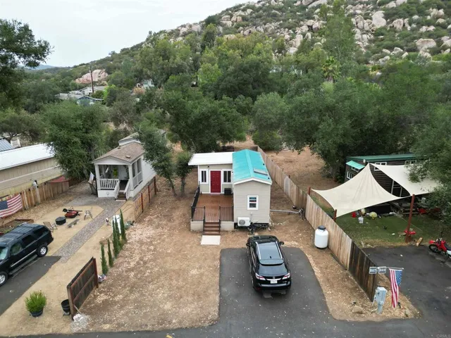 an aerial view of a house with swimming pool