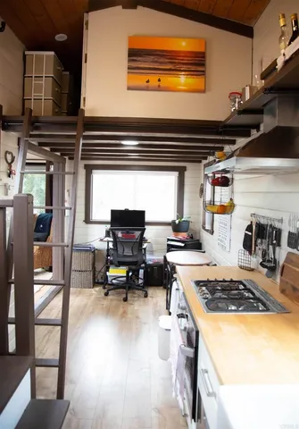 a kitchen with a stove and a microwave