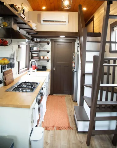 a kitchen with a stove and a refrigerator