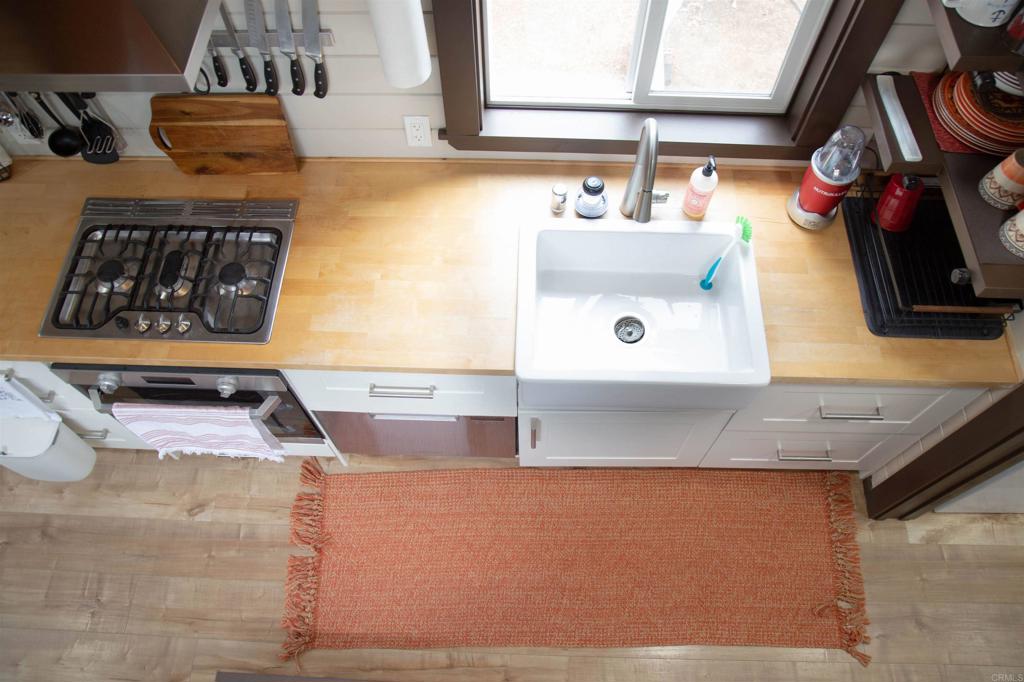 14625 Mussey Grade Road, Unit R67 Ramona, CA 92065 - Photo 7 of 31 a bathroom with a sink and a mirror