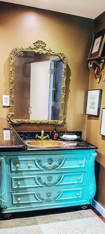a stove top oven sitting inside of a kitchen