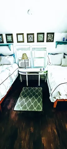 a living room with a bed and furniture