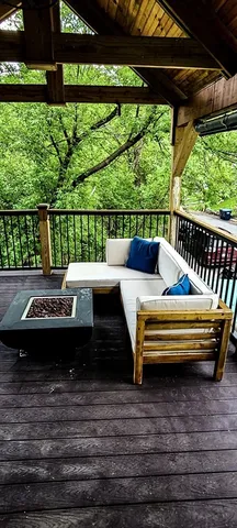 a view of a wooden deck with furniture