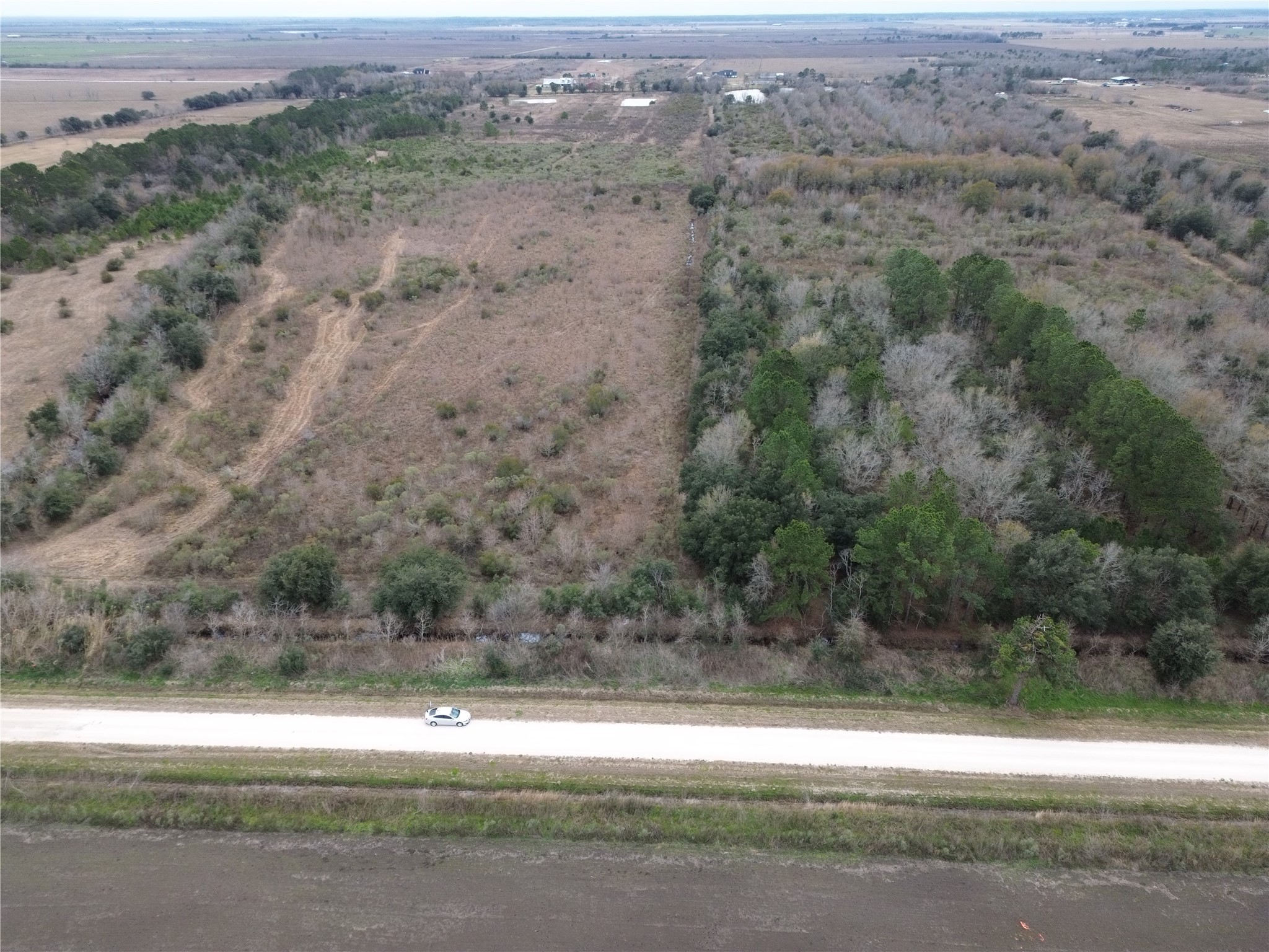 Tbd Heller Road Anahuac, TX 77514 - Photo 4 of 5 a view of a yard with a mountain