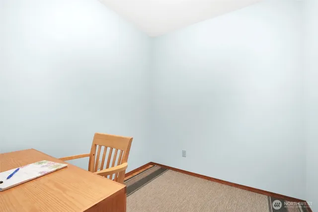 a view of a room with table and chair