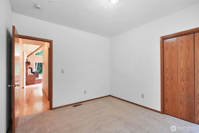 a bathroom with a shower a mirror and a sink