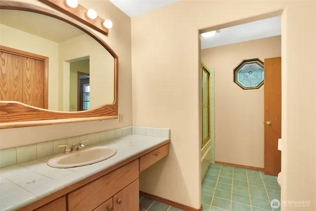 a bedroom with a bed and a couch