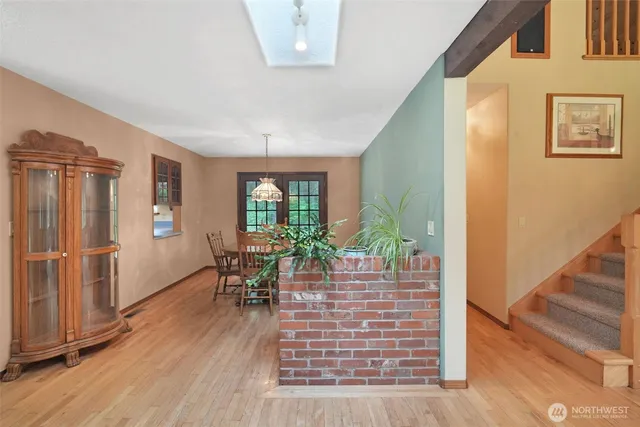 a view of a livingroom with furniture window and wooden floor