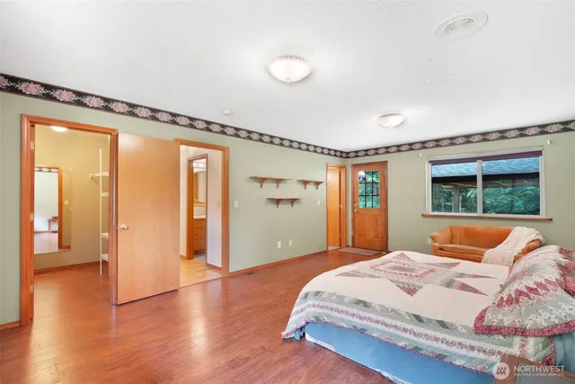 a kitchen with stainless steel appliances granite countertop a stove a sink and a white cabinets