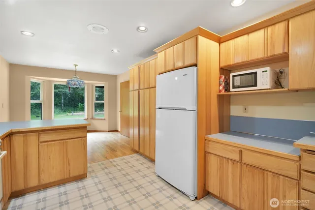 a room with pool table and window