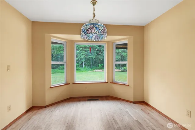 a room with pool table and a window
