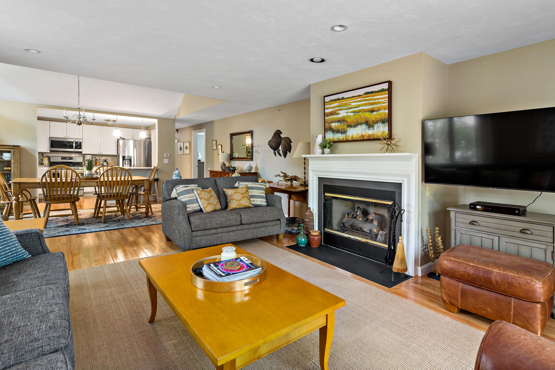 6 Friendship Court Mashpee, MA 02649 - Photo 11 of 39 a living room with furniture and a flat screen tv