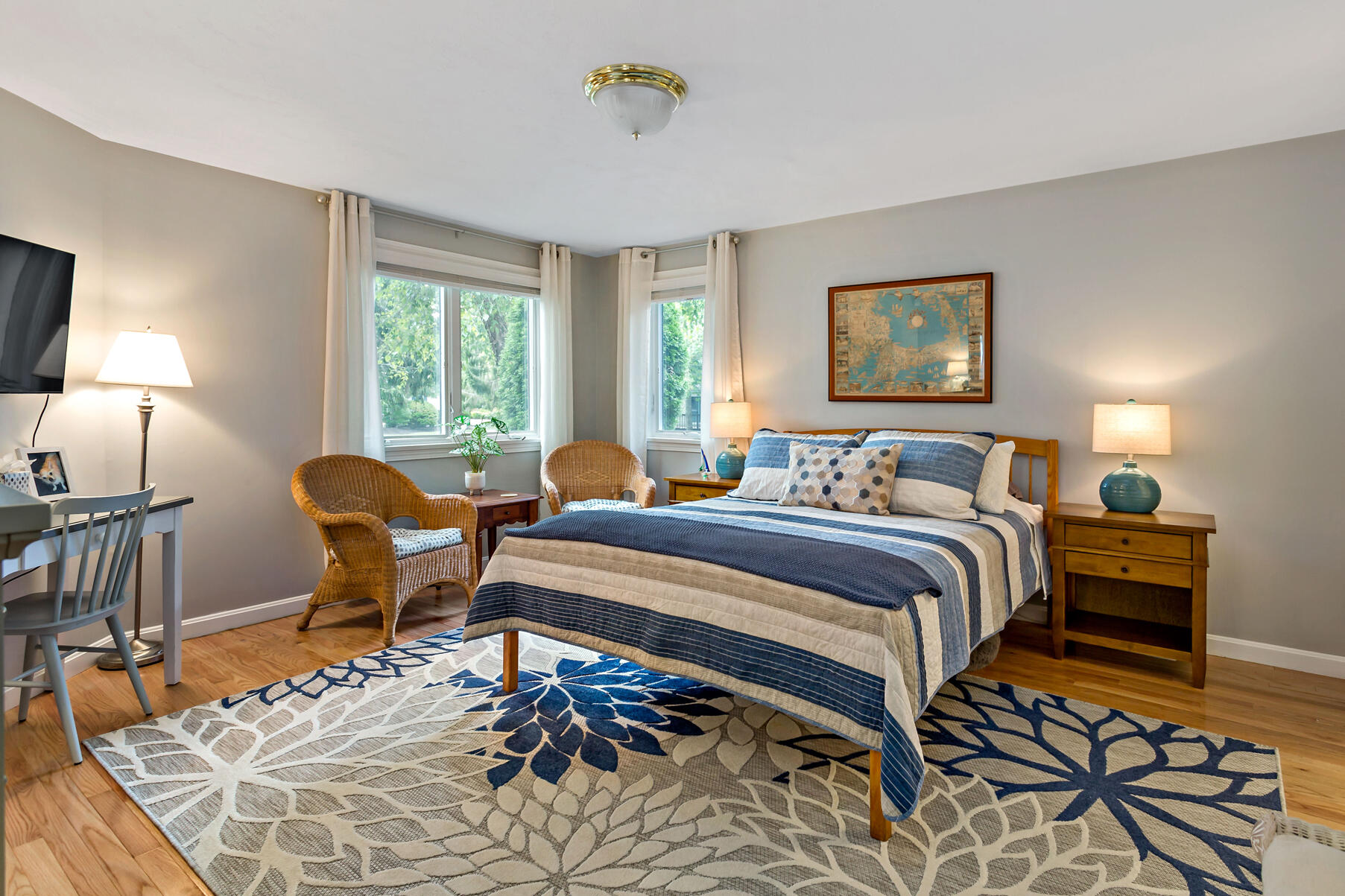 6 Friendship Court Mashpee, MA 02649 - Photo 12 of 39 a bedroom with a bed a lamp on desk and a window